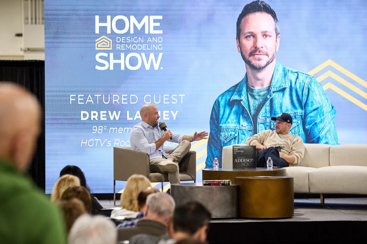 Adam Kayce interviewing Drew Lachey on stage at the Home Design and Remodeling Show